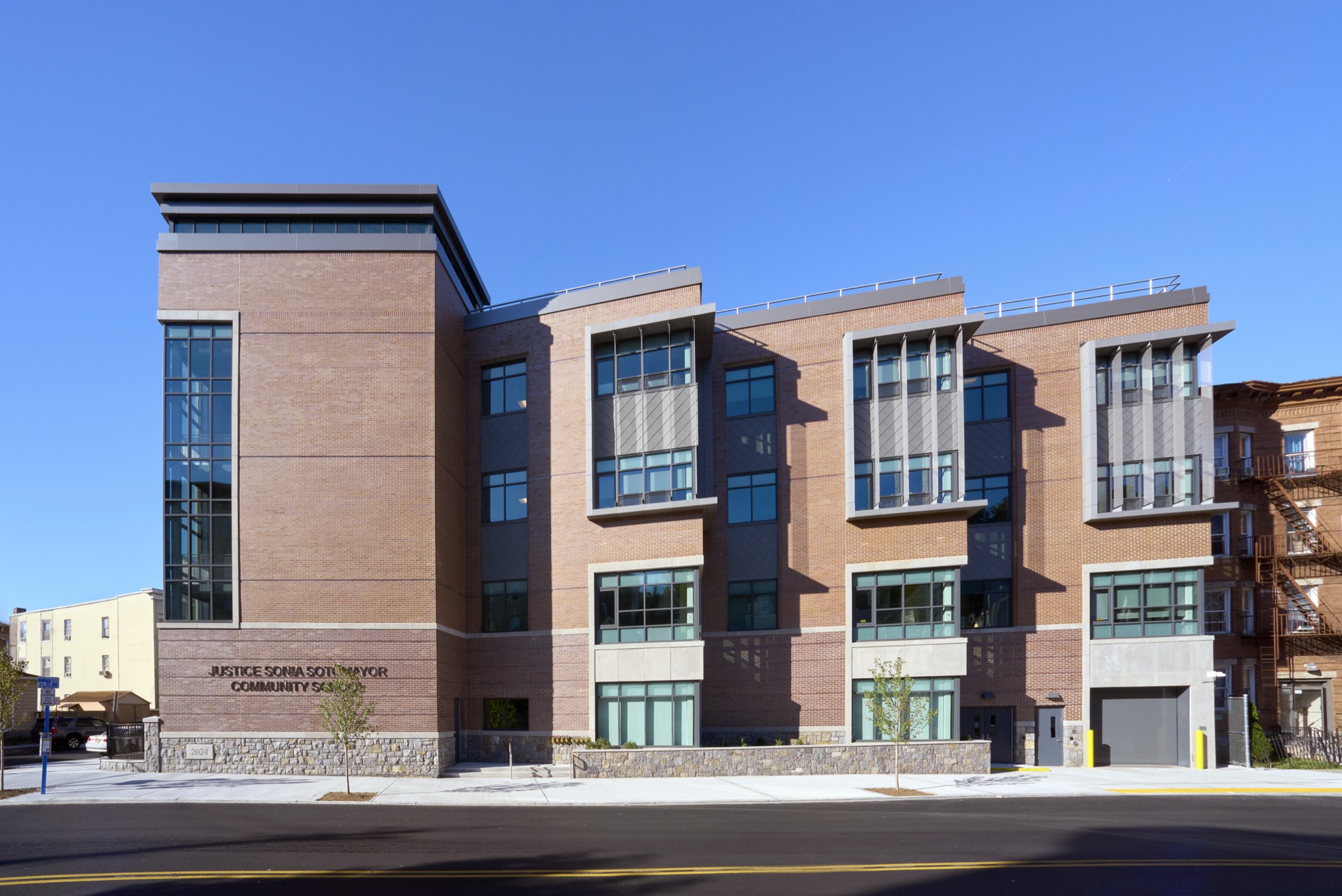 Justice Sonia Sotomayor Community School, a four-story brick building with projecting window bays